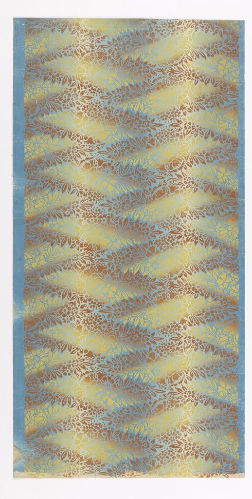 A repeating white stencil flower and leaves pattern on a gold background. A zigzag darkened pattern in light brown goes through the entire work. There are negative parallegram spaces inbetween the pattern which have a lightened effect. The entire piece appears to shine with golden light.