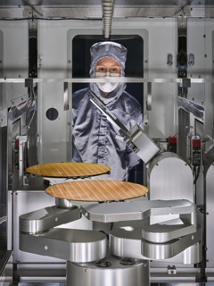 Photograph, Lydia Fox inspecting a wafer sorter