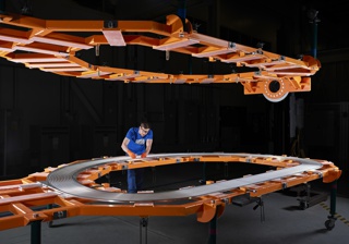 Photograph, Josh Morrison assembling the inner track on the D-shaped superconducting magnet for the fusion device SPARC