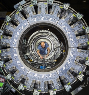 Photograph, Mark Tatum ssembling a Discovery IP PET/CT scanner