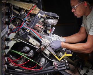 Photograph, Anderson Hernandez forming the 990 running shoe toe box
