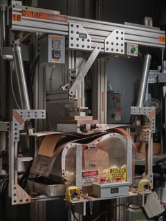 Photograph, View looking up at the subfab of a semiconductor fabrication facility