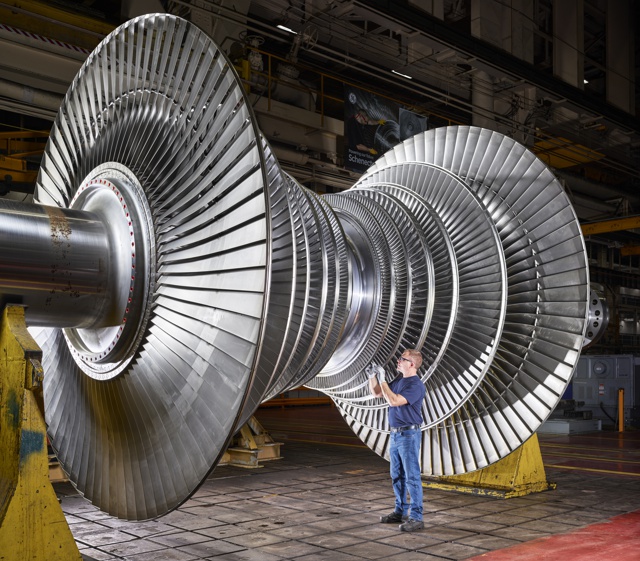Photograph, Ron Folmsbee inspecting a low-pressure steam turbine rotor
