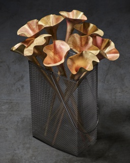 Photograph, Trumpet bells before being shaped on a lathe