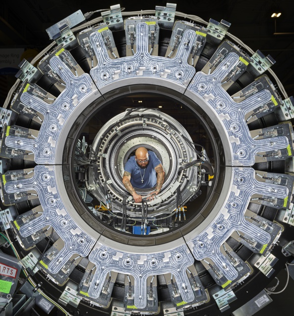 Photograph, Mark Tatum ssembling a Discovery IP PET/CT scanner