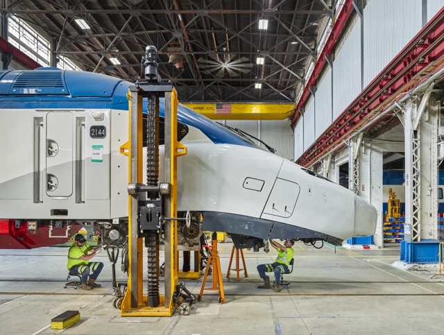 Photograph, Christopher Johnson and Guy Sick inspecting a high-speed Avelia Liberty power car before installing the wheels and frame under the train