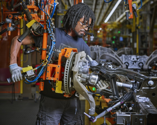 Photograph, Jaylin Jones decking a rear brake caliper on the frame of an F-150 Lightning