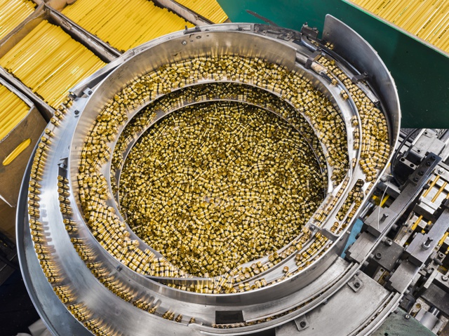 Photograph, Ferrules being loaded onto a conveyor and sent to a tipping machine, 2016
